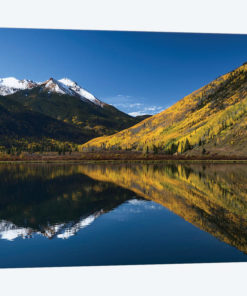 Red Mountain and autumn aspen trees reflected on Crystal Lake, Ouray, Colorado