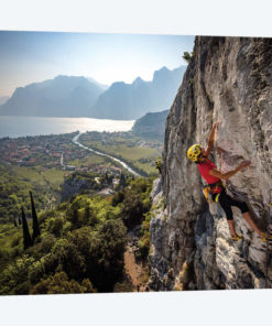 A Climber Above The Town Of Arco And Lago di Garda, Italy