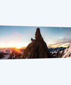 A Climber At Sunrise On Aiguille du Chardonnet, Chamonix, France