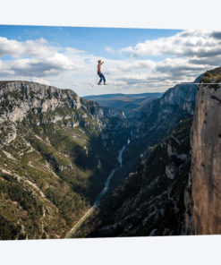 A Highliner In Verdon Gorges, Hundreds Of Meters Above The Ground, Paca, France