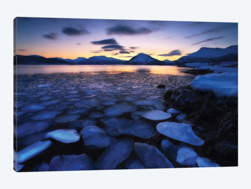 Ice Flakes Drifting Against The Sunset In Tjeldsundet Strait, Troms County, Norway