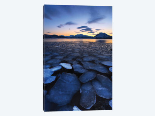Ice Flakes Drifting Towards The Mountains On Tjeldoya Island, Norway